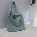 Detailed view of mint green canvas tote bag featuring premium fabric and zipper closure - Haze Blue