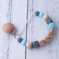 Silicone and beech wood baby pacifier clip chain with BABY letter beads on wood background - Blue