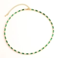 Detail of gold necklace with green rectangular stones and clear round gems on white - Green Necklace