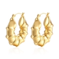 Chic 18K gold hollow bamboo earrings with glossy croissant texture on white backdrop - Bamboo Hollow Gold