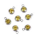 Detailed view of round yellow crystal birthstone pendants with silver stainless steel rings - Yellow Silver Base