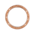 Macro shot of sparkling champagne crystal car engine start button decorative ring trim - Peach