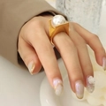 Minimalist gold titanium steel ring with a large white pearl in a concave setting - US 8 / Gold