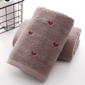 Thick cotton face towel in light brown with red heart embroidery and soft looped texture - Tan