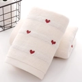 Soft white cotton towel featuring red heart embroidery and thick absorbent texture - Milky White