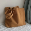 Sac cabas en toile caramel montrant les détails du tissu et les doubles poignées - Chameau
