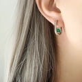 Elegant U-shaped silver steel earrings with translucent green agate stone on model - Steel Green Agate