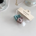 Detail of matte Morandi blue and rose hair clips in accessories packaging - Khaki And Lake Green