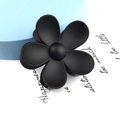 Detailed view of large black matte flower hair claw clip with frosted texture finish - Large Flower Style / Black