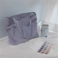 Detail of lavender canvas tote bag with clear fabric texture in a cozy setting - Light Purple