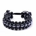 Dettaglio del bracciale intrecciato a tre strati con pietra lavica e perle di ossidiana - Bracciale 8mm a 3 File in Lava e Agata
