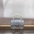 Close-up of mini silver glitter jelly bag with pearl handle and quilted texture details - Sparkle Silver