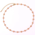 Detail of pink daisy pendant necklace with 18K gold chain and lobster clasp closure - Pink Necklace