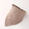 Detailed texture of muslin cotton baby bib in light brown with secure snap button - Dark Coffee
