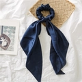 Elegant navy blue silk scrunchie with long ribbon tails on white fabric - Blue