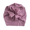 Detail view of the ribbed cotton fabric and oversized flower on this rose baby turban hat - Purple