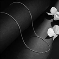 Elegant silver-toned stainless steel O-chain necklace displayed on a dark surface - Polished Chain (L22) - Silver