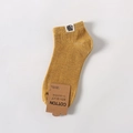 Ginger yellow low-cut cotton wool mix socks featuring a robot tag and brown paper label - One Size / Turmeric