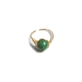 Close-up of handmade gold wire wrapped ring with a green spotted natural stone - One Size / Green