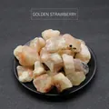 Golden strawberry sunstone raw crystal chips in a minimalist black display tray - Sunstone