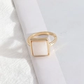 Minimalist golden ring featuring a square white natural stone inlay with marble texture - Medium Size White Stone