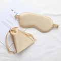 Champagne silk sleep mask and matching drawstring pouch set with a luxurious satin finish - Gold