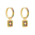 Detailed macro view of colorful zircon crystals set in gold-plated hoop earrings with pendants - Colorful
