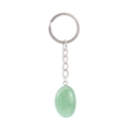 Macro detail of oval green natural agate stone keychain with silver metal chain on white - Green Aventurine