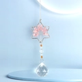 Macro detail of Tree of Life rose quartz crystal charm with faceted glass prism pendant - Hexagram Rose Quartz