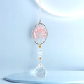 Detail of Rose Quartz Tree of Life hanging ornament with a faceted clear crystal ball prism - Oval Rose Quartz