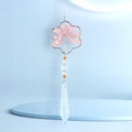 Detail of rose quartz tree of life within cloud frame and a clear crystal prism pendant - Snowflake Rose Quartz