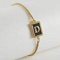 Minimalist gold adjustable chain bracelet with black enamel square pendant featuring letter D - Letter D