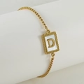 Detail of gold box chain bracelet with white shell inlay square pendant and letter D - Letter D / Gold/White Shell