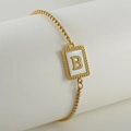 Detail of adjustable gold box chain bracelet with white shell pendant and letter B charm - Letter B / Gold/White Shell