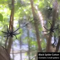 Detail of black stretchable spider web with two plastic spiders on a tree trunk - 20g Web + 2 Spiders / Black