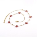 Gold-tone stainless steel chain necklace with small red crystal flowers and heart charm - Dark Red Necklace