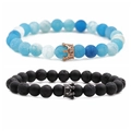 Detail of 8mm lava stone and beaded bracelets featuring crown charms on a white background - Style 1 Rose Gold Crown Set