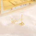 Minimalist gold butterfly S925 sterling silver stud earrings on white textured fabric - Gold