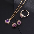Macro detail of gold-plated jewelry set featuring purple zircon and halo diamonds - Style D / Purple