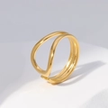 Minimalist double-layered gold wave ring on a white geometric stone pedestal - Size 7 (Adjustable) / Gold