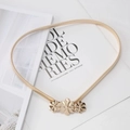 Detail of a golden elastic waist chain with three 3D floral buckles on marble surface - Gold Mixed Three Flowers Buckle Spring Chain