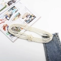 Detail of four-layer elastic pearl belt with an elegant flower buckle over denim jeans - Flower Pearl Rhinestone (Silver)