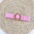 Detailed view of pink woven straw belt with a natural round wooden buckle and leather tip - Round Buckle Pink