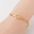 Detail of interlocking twin hearts gold bracelet on wrist with elegant titanium steel finish - Double Heart / Gold