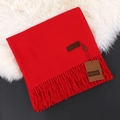 Red cashmere feel scarf with fringe trim and leather tag folded on white fur - China Red