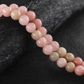 Pulsera de cuentas de calcedonia rosa y amarilla con forma redonda y acabado brillante - Piedra del sol