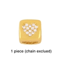 Close-up of golden heart-shaped cubic pendant with sparkling diamond rhinestones - Heart / Gold Cube