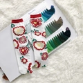 Detailed macro shot of white Tabi socks with vibrant red floral patterns and ribbed cuffs - 35-41 / White Daisy Day