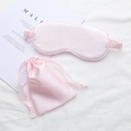Pink faux silk sleep mask and storage bag set displayed on white bedding - Light Pink No.23