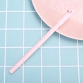 Pink cartoon cat gel pen with a cute bow tie cap on a pastel blue background - 0.5mm / Pink